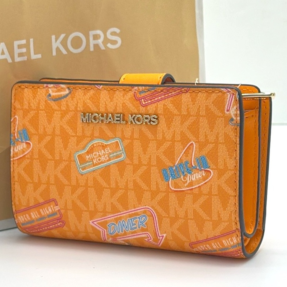 Michael Kors Jet Set Travel Medium Printed Signature Logo Bi-Fold
Pop Orange